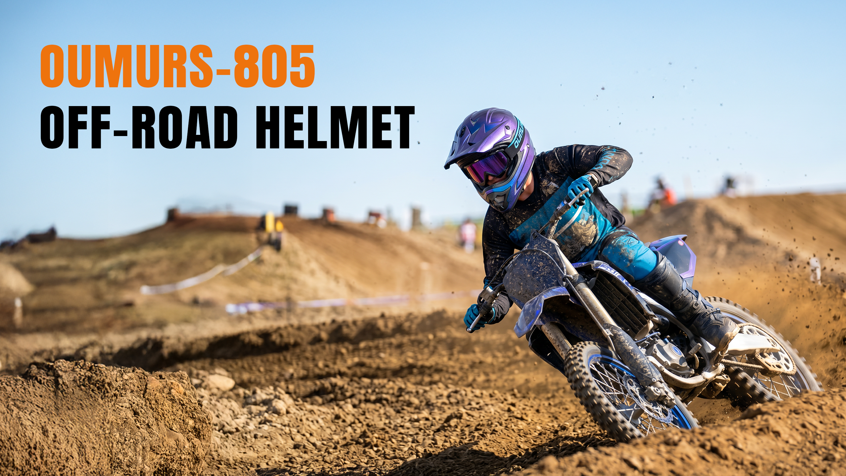 A motocross rider wearing an Oumurs 805 chameleon purple off-road helmet leans sharply on a dirt bike around a track