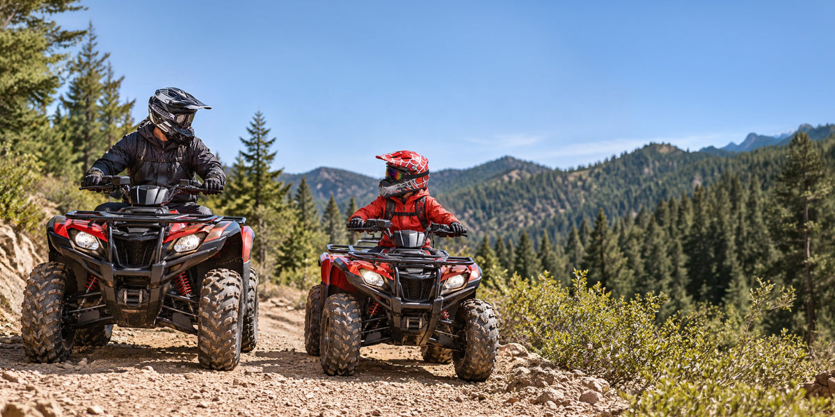 Two riders wearing helmets and protective gear riding red OUMURS ATVs on a mountain trail.