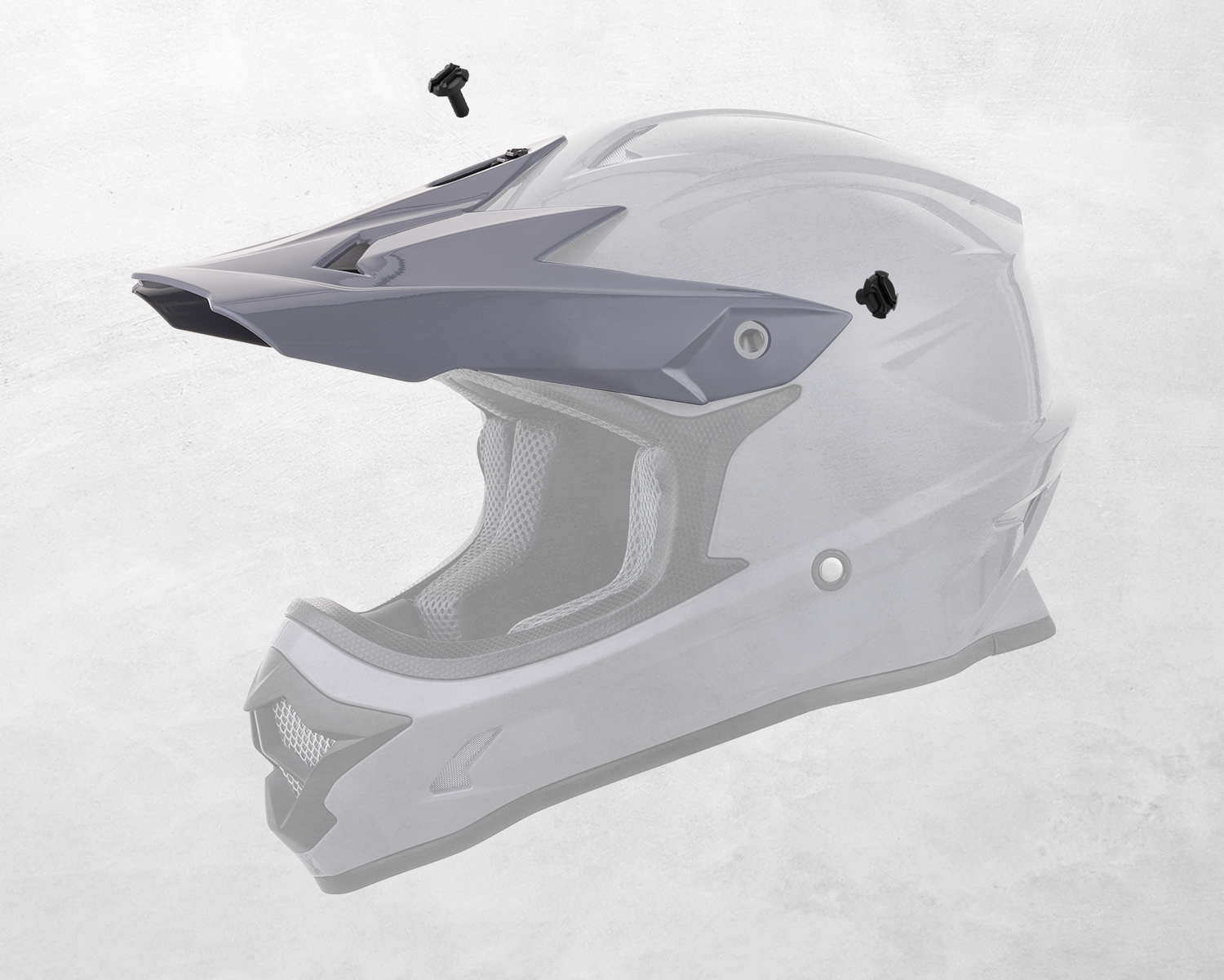 The Oumurs 805 Gray off-road helmet's peak shown detached with mounting screws.