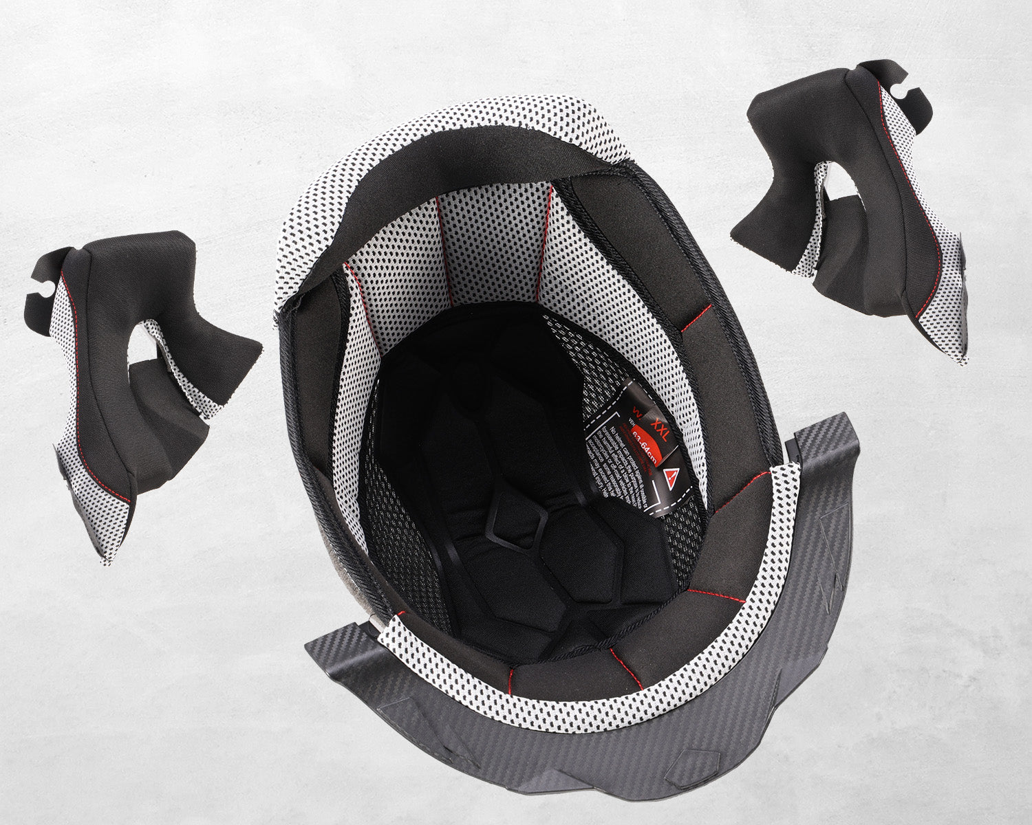 Close-up of the Oumurs 806 Matte Black helmet's removable, washable cheek pads and liner, detached from the shell