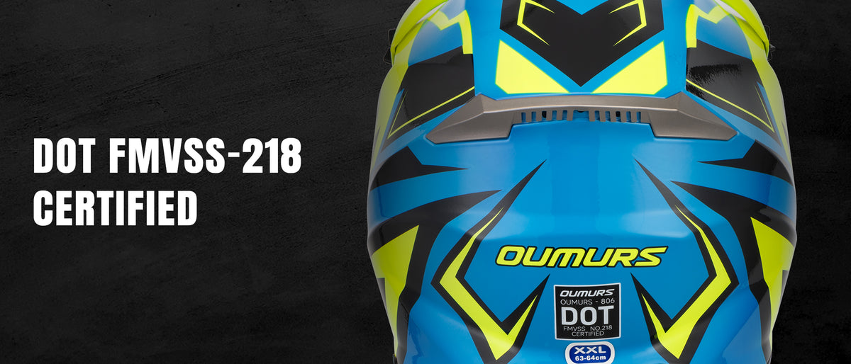 Blue and yellow Oumurs full-face motorcycle helmet shown close-up on a dark background, with white text reading 'DOT FMVSS-218 CERTIFIED' on the left.