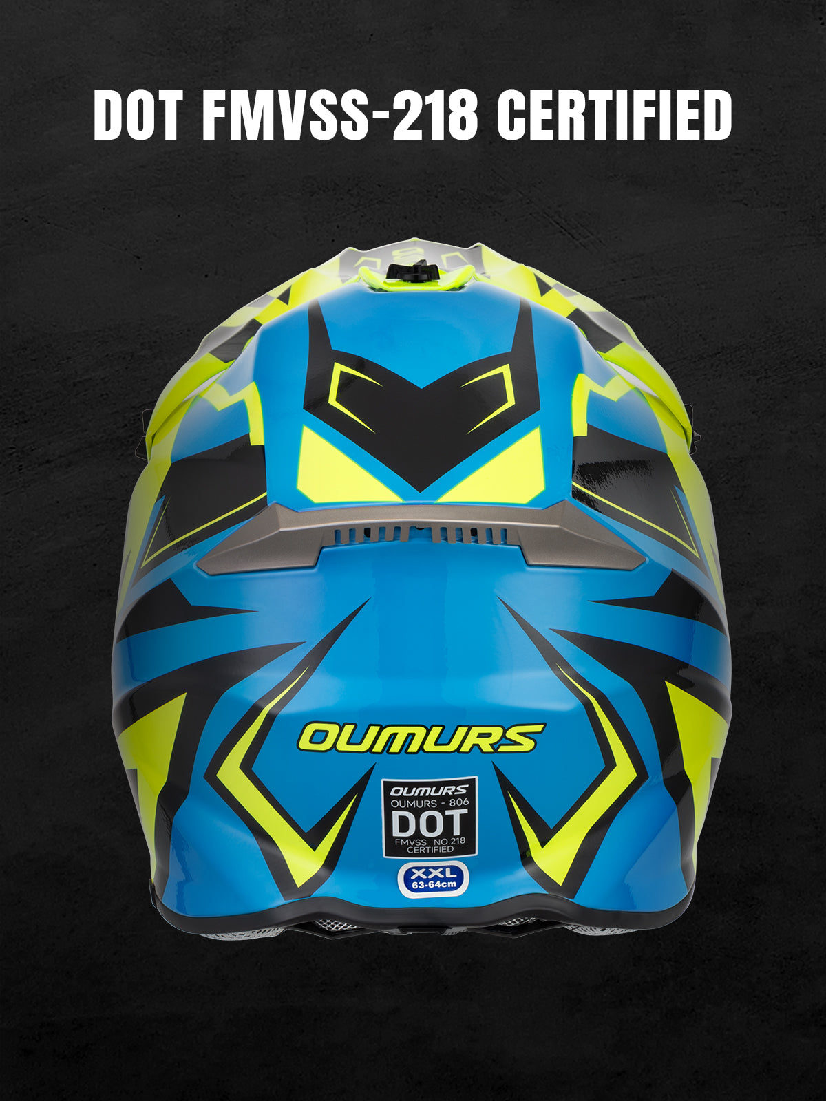 A blue and neon yellow full-face motocross helmet shown from the front against a dark textured background, with white text at the top reading 'DOT FMVSS-218 CERTIFIED'. The helmet features geometric black and neon yellow graphics, a clear visor, and visible OUMURS branding.