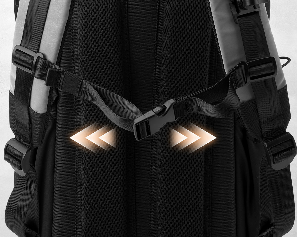 Close-up of a black backpack back panel with adjustable straps and buckles, showing two illuminated arrow graphics overlaid on the center.